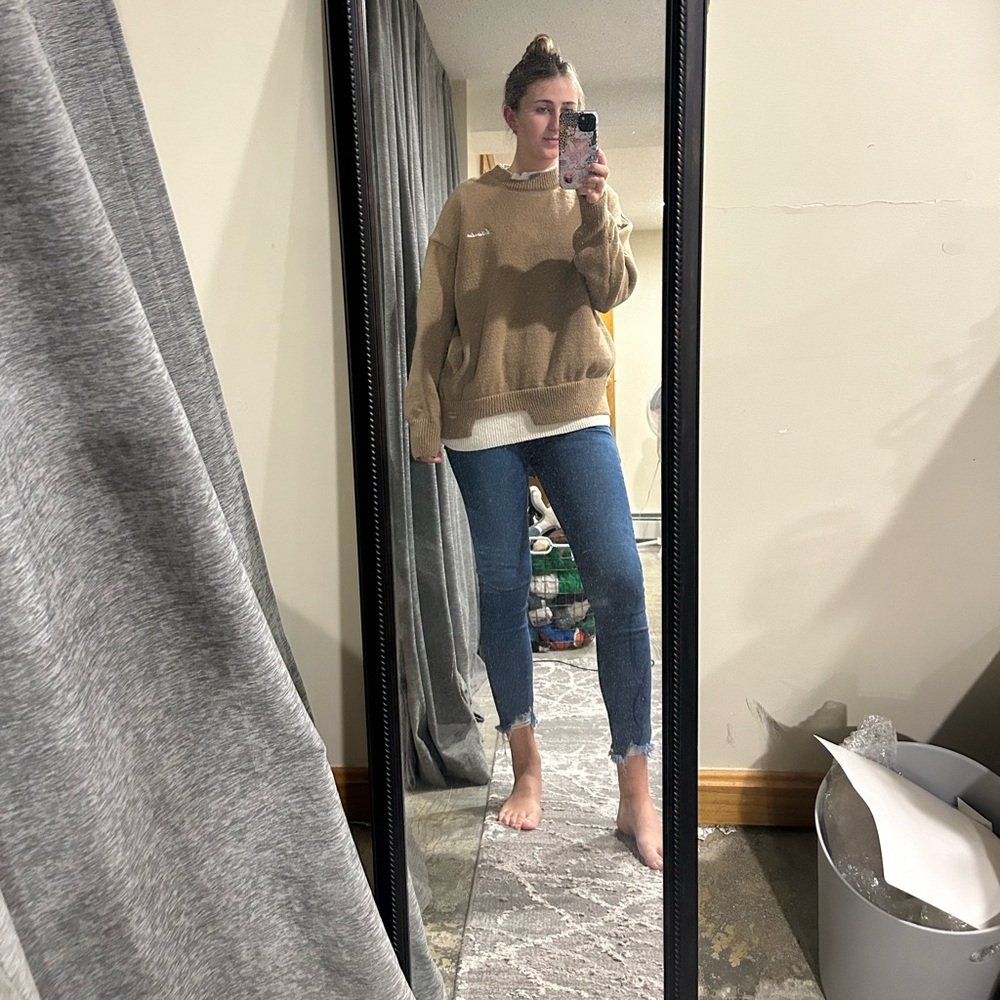 neutral sweater with cut out detail